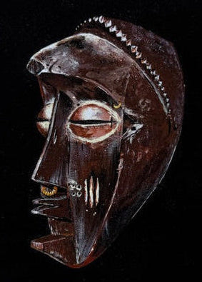 Wooden mask with intricate carvings on a black background