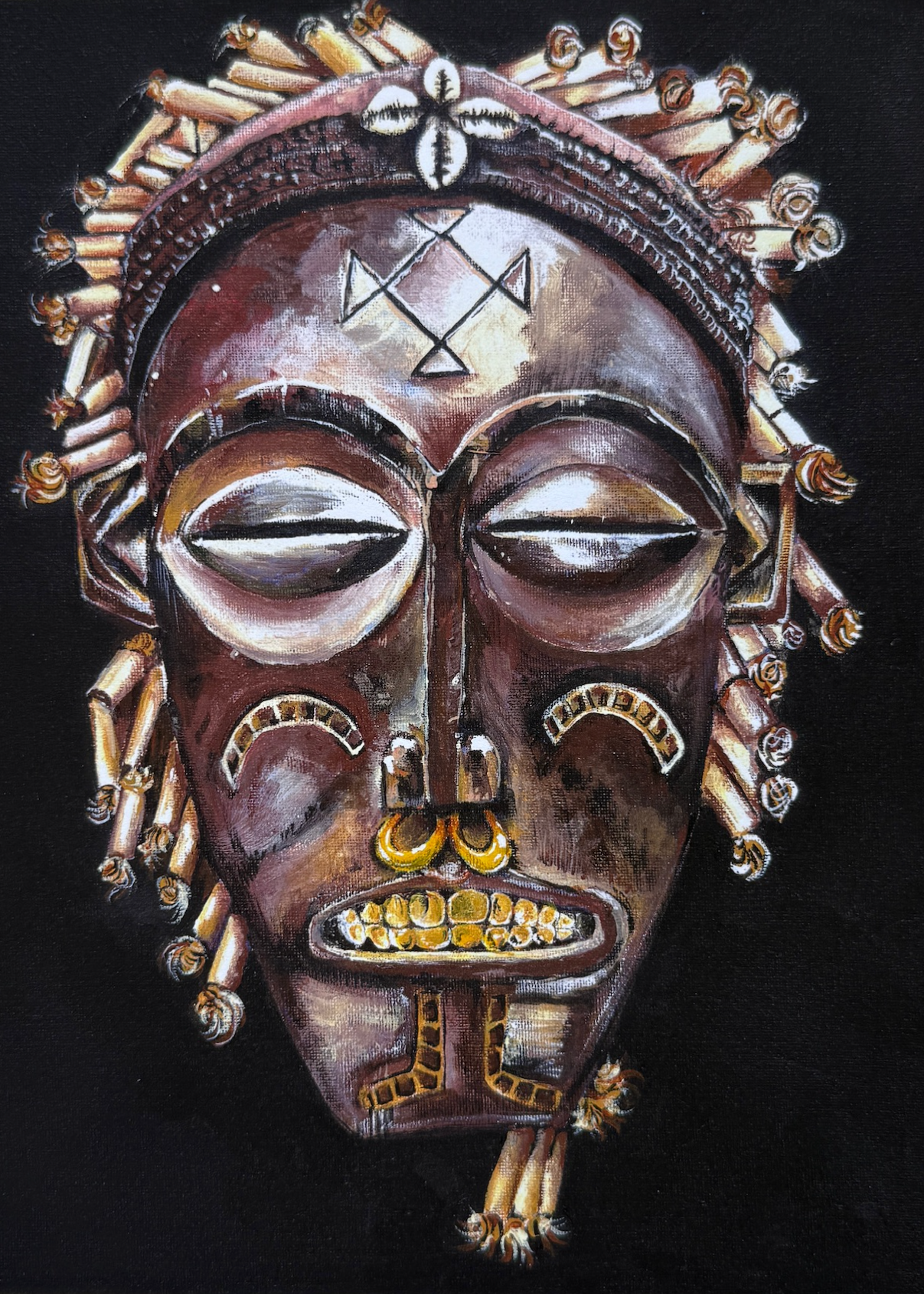 Decorative mask with intricate designs on a black background
